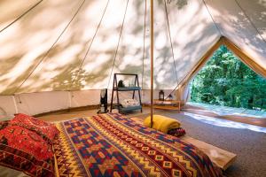 Voodi või voodid majutusasutuse Glamping Dos Rios toas