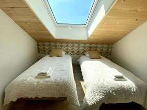 Katil atau katil-katil dalam bilik di Chaleureux T3 avec terrasse/ Proche Valence