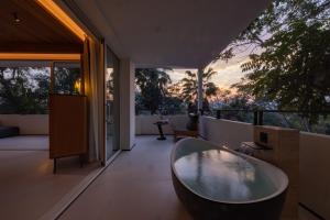 Foto Jinghongis asuva majutusasutuse Anlai Rainforest Wild Luxury Hotel galeriist +37 fotot