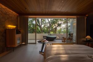 Foto Jinghongis asuva majutusasutuse Anlai Rainforest Wild Luxury Hotel galeriist