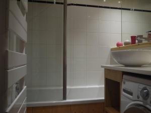 a shower with a glass door next to a sink at Appartement Méribel Mottaret 3 chambres, proche pistes, Wifi - FR-1-355-98 in Méribel +8 photos