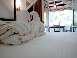 Ένα ή περισσότερα κρεβάτια σε δωμάτιο στο White Villa - Homestay