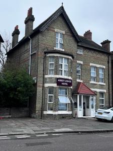 an old brick building with a sign that reads anxiety roomuth at Abbey Lodge Hotel in London