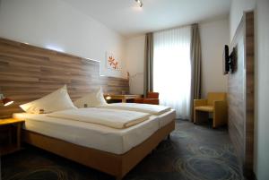 Llit o llits en una habitació de Petul Apart Hotel Residenz