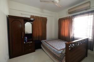 Ένα ή περισσότερα κρεβάτια σε δωμάτιο στο 'Uttara Oasis' Luxury Apartment