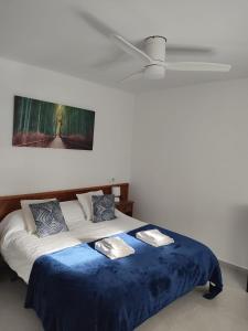 Ein Bett oder Betten in einem Zimmer der Unterkunft Cala Ferrera HOME&ME