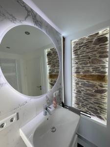 a bathroom with a sink and a mirror at ADVENTURE LuxusApartment in Wetzlar +30 photos