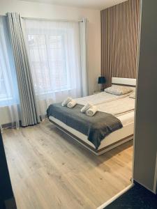 Posteľ alebo postele v izbe v ubytovaní Twój Salon-Apartamenty Stare Miasto