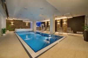 a large swimming pool in the middle of a building at Rodinné chatky Kraskov in Chrudim