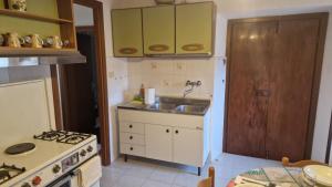 Kuchyň nebo kuchyňský kout v ubytování Casa sulla Scarpata