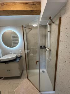 a bathroom with a shower and a sink at Apartament Centro 10 in Leszno +27 photos