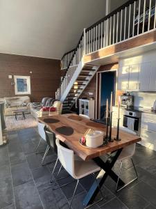 a kitchen and dining room with a wooden table at Storklinten 119 in Boden