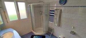 a bathroom with a shower and a sink at Casa Diana Ticino in Cugnasco +49 photos