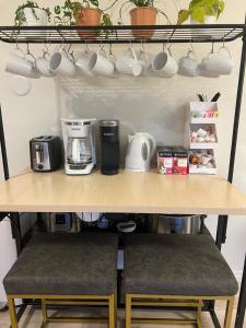 a shelf with cups and coffee cups on it at Family Fun! 5 King Beds-Hot Tub-Fire Pit-Ski-Hike in Sandy