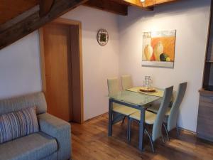 a dining room with a table and a chair at Ferienwohnung Wangerooge in Burhave in Butjadingen