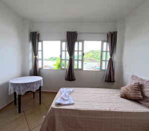 Postel nebo postele na pokoji v ubytování Hostel Chico Lessa