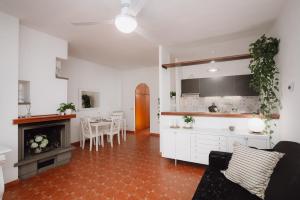 a living room with a kitchen and a dining room at Roma, Mare e Relax in Marina di Cerveteri +30 photos
