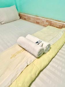 Postel nebo postele na pokoji v ubytování Bankhunchang Ramkhamhaeng hotel