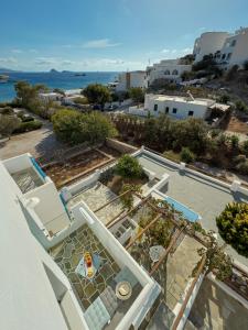 an aerial view of a villa with a view of the ocean at ANETON Residences in Karavostasi