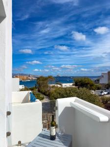 a view of the ocean from the balcony of a house at ANETON Residences in Karavostasi