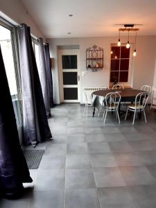 a dining room with a table and chairs at 8 seater house near Chinon in Beaumont-en-Véron