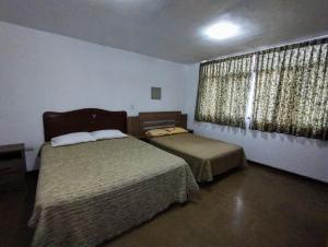 Postel nebo postele na pokoji v ubytování Casa Extremadura