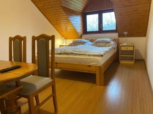 Postel nebo postele na pokoji v ubytování Csók Apartmanház