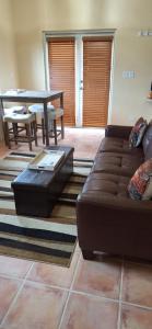 Posezení v ubytování Chinna Cottage