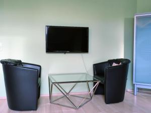 Televisyen dan/atau pusat hiburan di Freundlich helles Appartment
