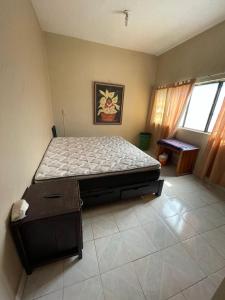 a bedroom with a large bed in a room at Apartamento Ocosingo in Ocosingo