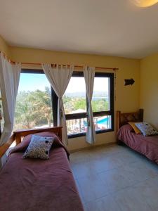 En eller flere senge i et værelse på Duplex con vista al Lago