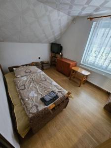 Posteľ alebo postele v izbe v ubytovaní Chata Růžovka v Jeseníkách