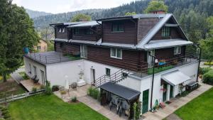 an aerial view of a large house with a yard at Leonówka Bieszczady in Cisna