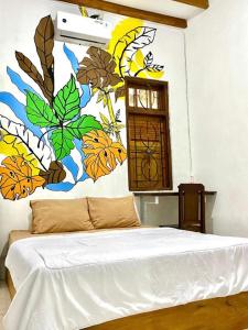 מיטה או מיטות בחדר ב-Zzz Hostel Ijen