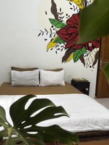 מיטה או מיטות בחדר ב-Zzz Hostel Ijen
