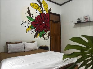 מיטה או מיטות בחדר ב-Zzz Hostel Ijen