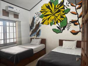 מיטה או מיטות בחדר ב-Zzz Hostel Ijen