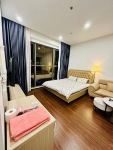 Ένα ή περισσότερα κρεβάτια σε δωμάτιο στο M1T24 Studio toà Masterise