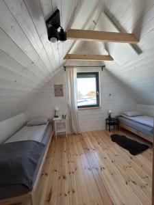 Una cama o camas en una habitación de Sowi Sierp Domek w Górach Sowich