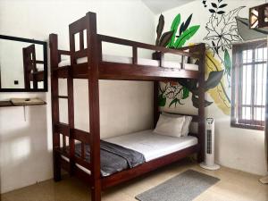 מיטה או מיטות בחדר ב-Zzz Hostel Ijen