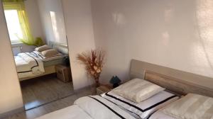a bedroom with two beds and a window in it at Mieszkanie niedaleko centrum in Gdańsk