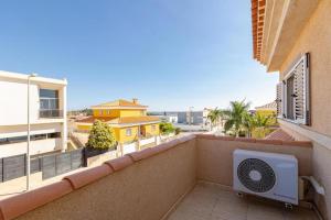 a balcony with a air conditioner on a building at Meloneras Hills Private Villa in Meloneras +42 photos