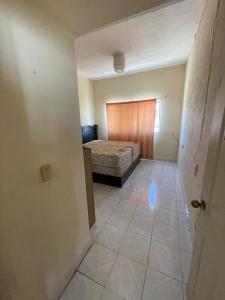 an empty room with a bed in a bedroom at Apartamento Ocosingo in Ocosingo