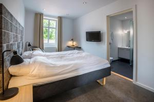Voodi või voodid majutusasutuse Hotel Birksø toas