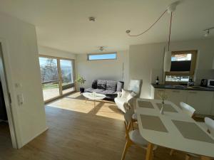 a living room with a couch and a table at Fewo Grafenblick in Balingen
