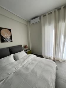 Postel nebo postele na pokoji v ubytování Feels Like Home 2 - Agrinio Suites