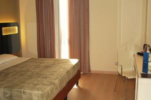 Postel nebo postele na pokoji v ubytování Idea Hotel Plus Savona