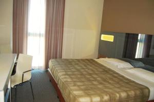 Postel nebo postele na pokoji v ubytování Idea Hotel Plus Savona