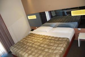 Postel nebo postele na pokoji v ubytování Idea Hotel Plus Savona