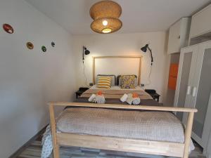 Łóżko lub łóżka w pokoju w obiekcie Apartamento CANELA